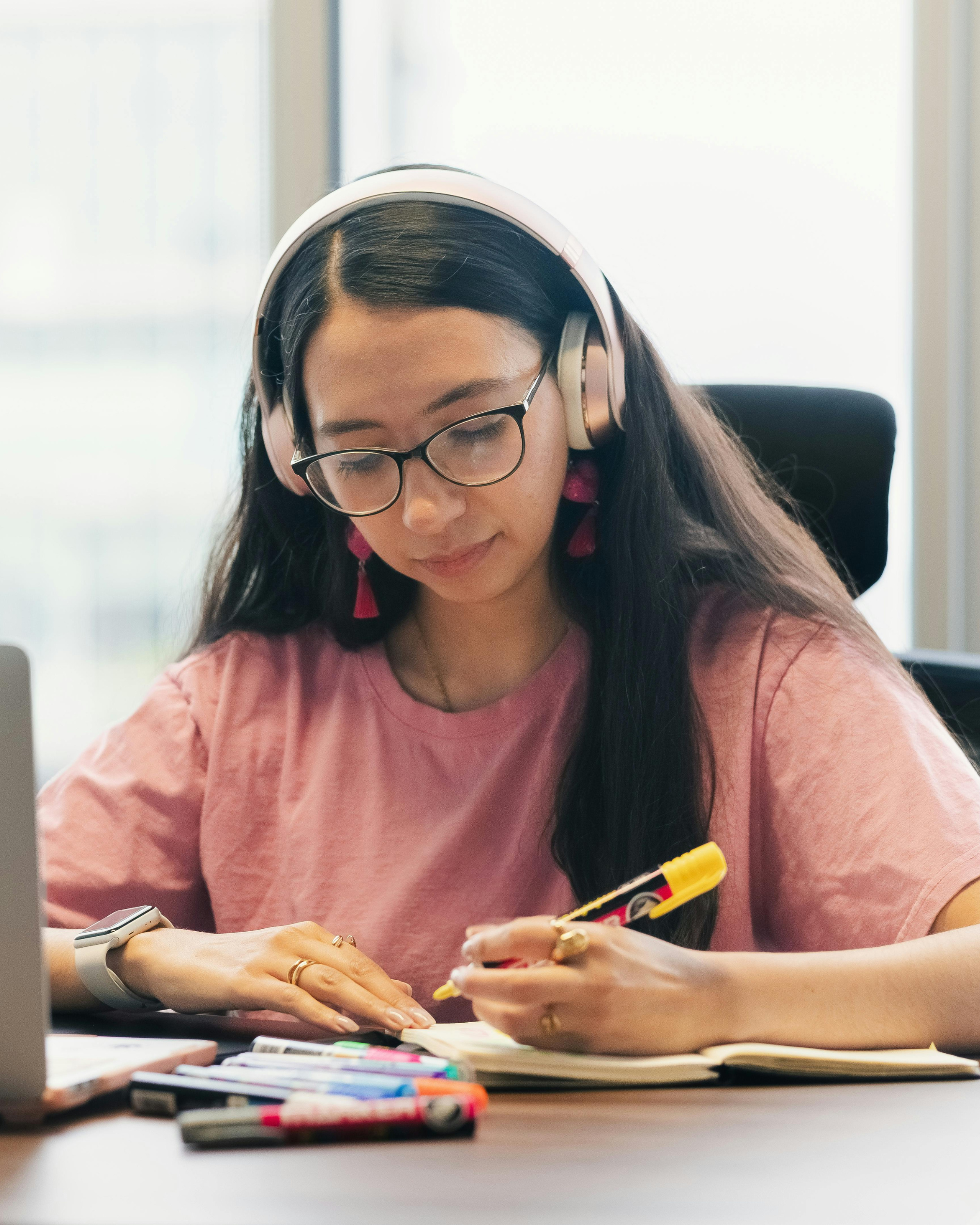 Student or tutor working on a laptop